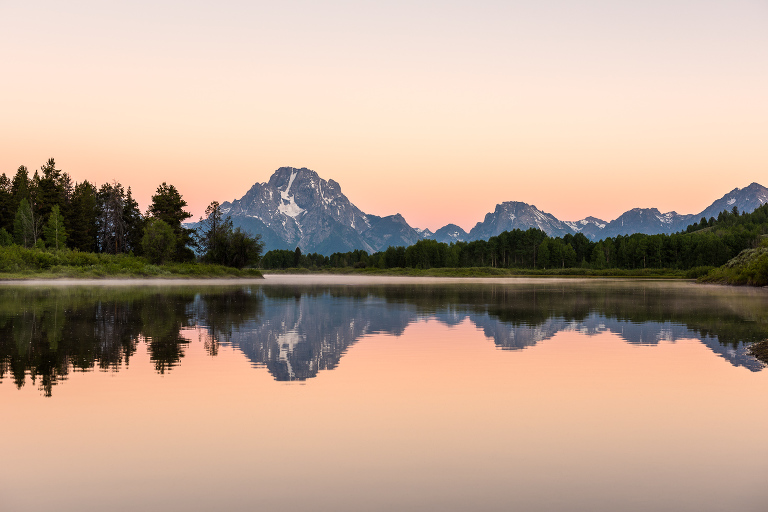 The Tetons reflected in the Snake river at Oxbow Bend in Grand Teton National Park, Wyoming.